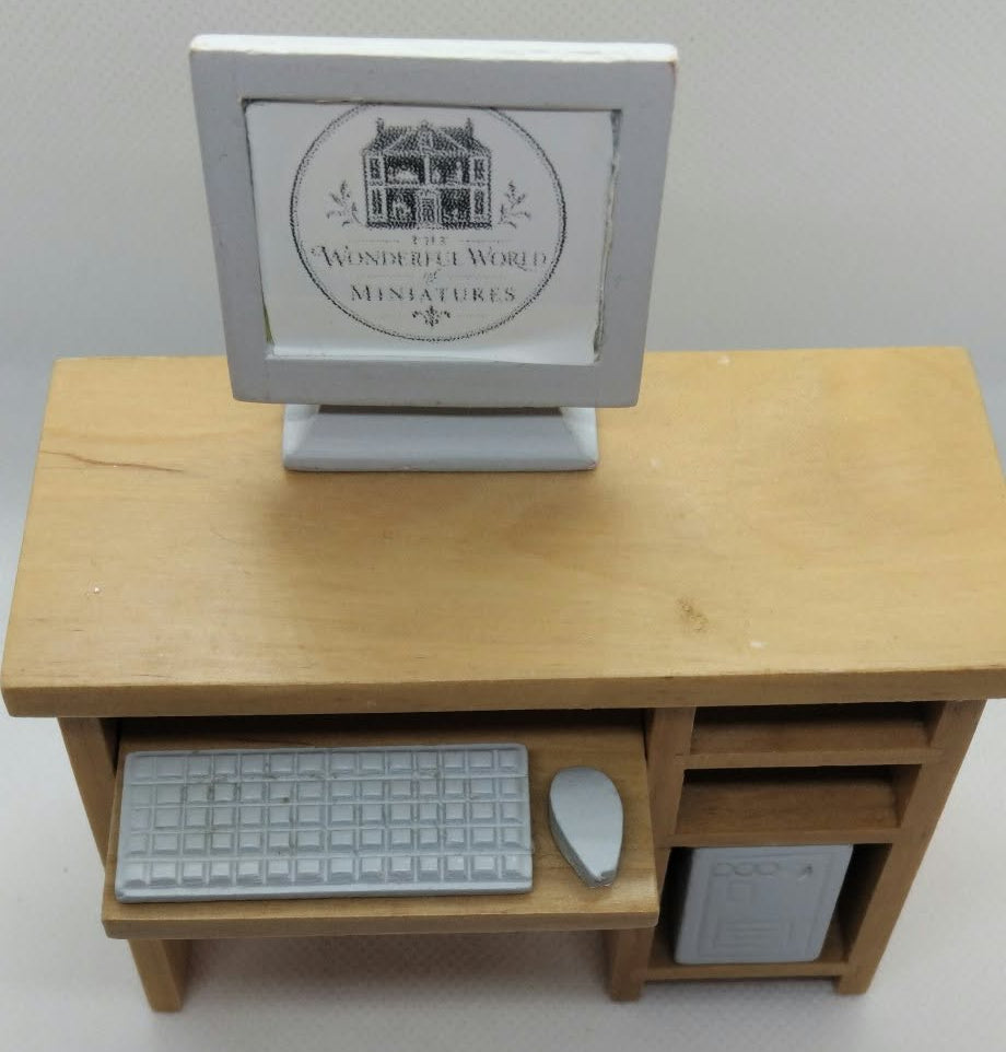 miniature computer desk in pine and white computer tower, mouse, keyboard and display on a white background.