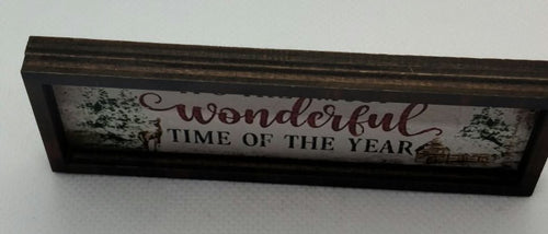 christmas decor sign in miniature on a white background