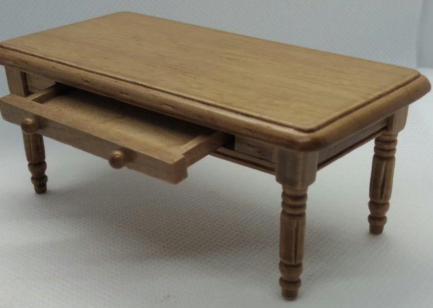A miniature wooden coffee table with a single drawer, shown on a plain white studio background.